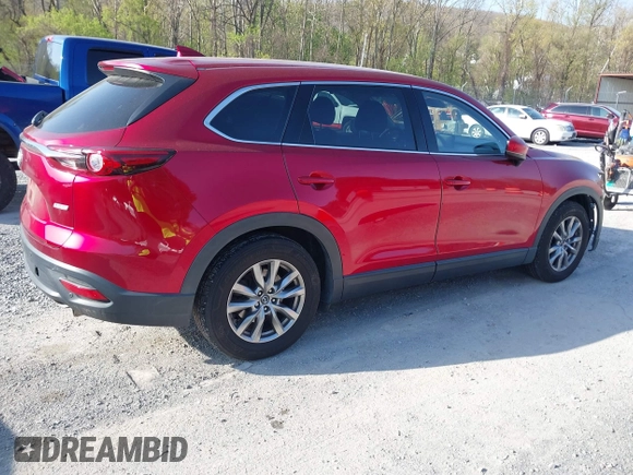 2019 Mazda CX-9 Touring with VIN JM3TCACY0K0310851, listed as a IAAI auction lot 42066395 with 91,046 mi miles and . Bid and sale history available at DreamBid. Image 4.