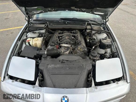 1997 BMW 8 Series z VIN WBAEF8325VCC31790, wystawiony jako Copart lot #85198614 z przebiegiem 115 638 mil mil oraz Czysty tytuł • Clean title. Historia ofert i sprzedaży dostępna na DreamBid. Obrazek 9.