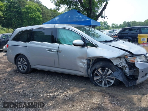 2014 Honda Odyssey Touring with VIN 5FNRL5H97EB054158, listed as a IAAI auction lot 42548360 with 91,161 mi miles and . Bid and sale history available at DreamBid. Image 13.