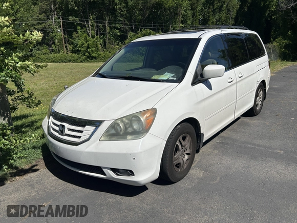2009 Honda Odyssey Touring with VIN 5FNRL38819B025126, listed as a IAAI auction lot 42219263 with 187,191 mi miles and . Bid and sale history available at carsss.com. Image 2.