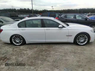 2015 BMW 7 Series 750Li with VIN WBAYE8C50FD781160, listed as a IAAI auction lot 41061232 with 154,496 mi miles. Bid and sale history available at carsss.com. Image 13.