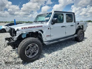 2023 Jeep Gladiator Rubicon z VIN 1C6JJTBG5PL585901, wystawiony jako Copart lot #60617795 z przebiegiem 12 702 mil mil oraz Szkoda całkowita • Salvage title. Historia ofert i sprzedaży dostępna na DreamBid. Obrazek 1.