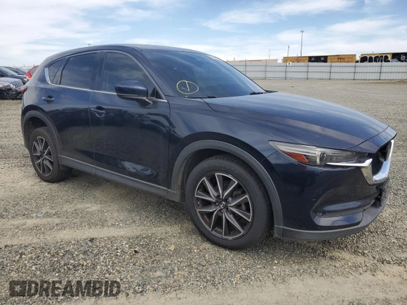 2017 Mazda CX-5 Grand Touring with VIN JM3KFADL2H0221149, listed as a Copart auction lot 50606915 with 140,518 mi miles and Clean Title. Bid and sale history available at carsss.com. Image 4.