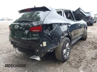 2017 Hyundai Santa Fe 2.4L z VIN 5XYZU3LB2HG434503, wystawiony jako IAAI lot #42197574 z przebiegiem 99 167 mil mil oraz . Historia ofert i sprzedaży dostępna na DreamBid. Obrazek 4.
