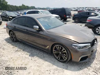 2020 BMW 5 Series M550i xDrive with VIN WBAJS7C08LCD82431, listed as a Copart auction lot 59518835 with 33,184 mi miles and Salvage title. Bid and sale history available at DreamBid. Image 4.