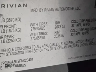 2023 Rivian R1S Launch Edition with VIN 7PDSGABL2PN020404, listed as a Copart auction lot 81428984 with 128 mi miles and Clean Title. Bid and sale history available at carsss.com. Image 10.