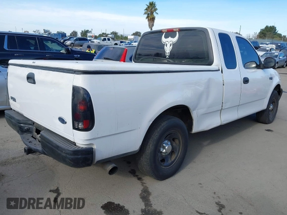 2000 Ford F-150 XL with VIN 1FTZX1727YKA78887, listed as a IAAI auction lot 41291272 with 289,343 mi miles. Bid and sale history available at carsss.com. Image 4.