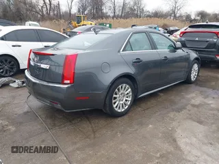 2011 Cadillac CTS Sedan Luxury with VIN 1G6DG5EY7B0163601, listed as a IAAI auction lot 41536256 with 106,523 mi miles. Bid and sale history available at carsss.com. Image 4.