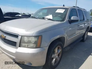 2007 Chevrolet Suburban LS with VIN 1GNFC16087J239886, listed as a IAAI auction lot 41874548 with 303,014 mi miles and . Bid and sale history available at DreamBid. Image 2.