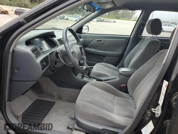 2000 Toyota Camry LE z VIN 4T1BF22K9YU949936, wystawiony jako Copart lot #54782815 z przebiegiem 239 139 mil mil oraz Szkoda całkowita • Salvage title. Historia ofert i sprzedaży dostępna na DreamBid. Obrazek 7.
