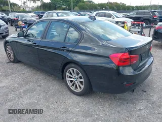 2018 BMW 3 Series 320i with VIN WBA8E1G57JNU88781, listed as a IAAI auction lot 42019246 with 56,820 mi miles. Bid and sale history available at carsss.com. Image 3.