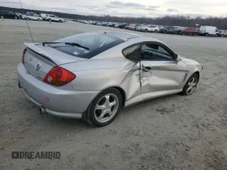 2003 Hyundai Tiburon GT z VIN KMHHN65F63U064962, wystawiony jako Copart lot #44804045 z przebiegiem 186 171 mil mil oraz Szkoda całkowita • Salvage title. Historia ofert i sprzedaży dostępna na DreamBid. Obrazek 3.