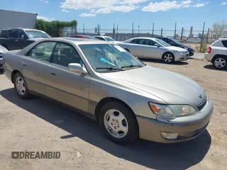 1999 Lexus ES 300 with VIN JT8BF28GXX5068712, listed as a IAAI auction lot 42563883 with 216,008 mi miles and . Bid and sale history available at DreamBid. Image 1.