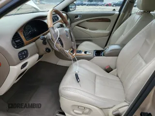 2003 Jaguar S-Type z VIN SAJEA01U33HM71782, wystawiony jako Copart lot #82969304 z przebiegiem 127 176 mil mil oraz Szkody całkowita. Historia ofert i sprzedaży dostępna na DreamBid. Obrazek 7.