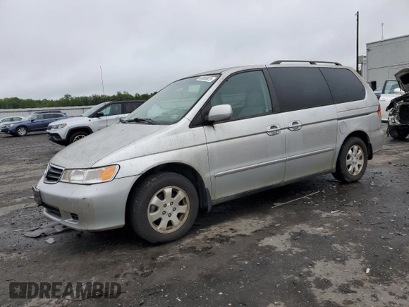 2003 Honda Odyssey EX z VIN 5FNRL18603B008148, wystawiony jako Copart lot #60669825 z przebiegiem 128 115 mil mil oraz Czysty tytuł • Clean title. Historia ofert i sprzedaży dostępna na DreamBid. Obrazek 1.