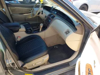 2001 Toyota Avalon XL z VIN 4T1BF28B21U145748, wystawiony jako IAAI lot #42251004 z przebiegiem 182 959 mil mil oraz . Historia ofert i sprzedaży dostępna na DreamBid. Obrazek 5.