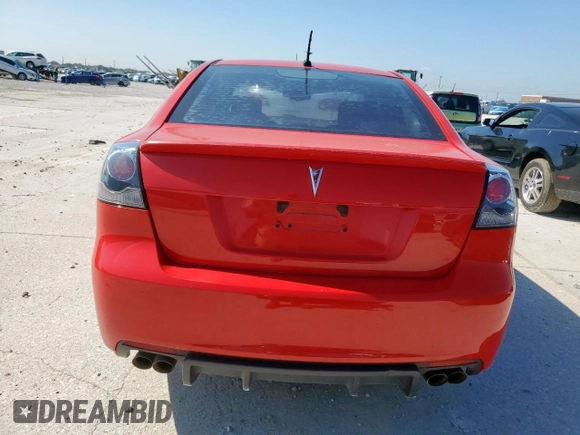2009 Pontiac G8 z VIN 6G2ER57779L184240, wystawiony jako Copart lot #53801105 z przebiegiem 214 448 mil mil oraz Czysty tytuł • Clean title. Historia ofert i sprzedaży dostępna na DreamBid. Obrazek 6.