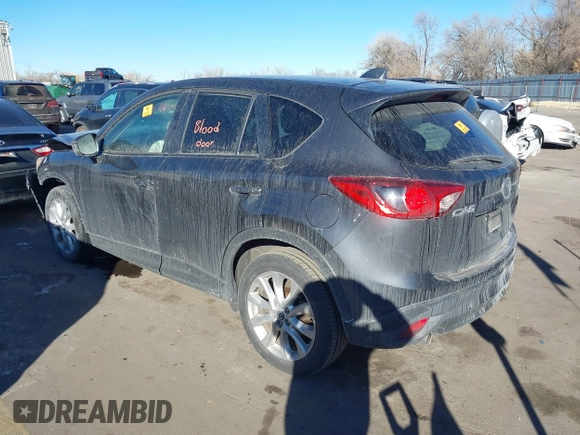 2014 Mazda CX-5 Grand Touring with VIN JM3KE2DY1E0421326, listed as a IAAI auction lot 41330794 with 127,589 mi miles. Bid and sale history available at carsss.com. Image 3.