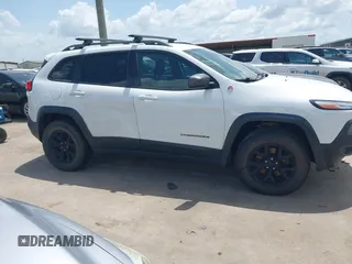 2014 Jeep Cherokee Trailhawk with VIN 1C4PJMBS5EW231448, listed as a IAAI auction lot 42632143 with 97,461 mi miles and . Bid and sale history available at DreamBid. Image 13.