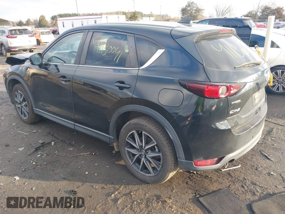 2018 Mazda CX-5 Touring z VIN JM3KFACM3J1435089, wystawiony jako IAAI lot #41130041 z przebiegiem 80 446 mil mil oraz . Historia ofert i sprzedaży dostępna na DreamBid. Obrazek 3.