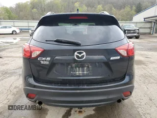 2014 Mazda CX-5 Touring with VIN JM3KE2CY8E0424757, listed as a Copart auction lot 54703195 with 111,401 mi miles and Salvage Title. Bid and sale history available at DreamBid. Image 6.