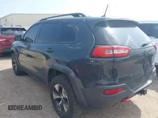 2016 Jeep Cherokee Trailhawk z VIN 1C4PJMBS0GW300131, wystawiony jako IAAI lot #42439009 z przebiegiem 173 571 mil mil oraz . Historia ofert i sprzedaży dostępna na DreamBid. Obrazek 3.