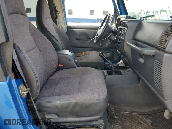 2002 Jeep Wrangler Sport with VIN 1J4FA49S32P762794, listed as a Copart auction lot 52132955 with 243,499 mi miles and Salvage Title. Bid and sale history available at carsss.com. Image 7.