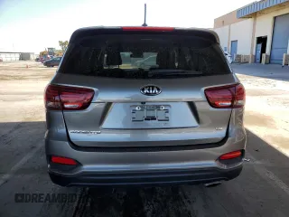 2019 Kia Sorento LX z VIN 5XYPGDA59KG463392, wystawiony jako Copart lot #54970245 z przebiegiem 99 576 mil mil oraz Szkoda całkowita • Salvage title. Historia ofert i sprzedaży dostępna na DreamBid. Obrazek 6.