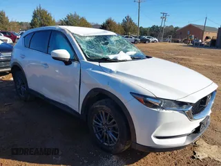 2020 Mazda CX-5 Touring with VIN JM3KFBCM0L0828207, listed as a IAAI auction lot 41305801 with 56,500 mi miles and . Bid and sale history available at DreamBid. Image 1.