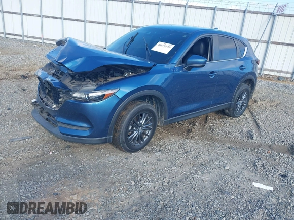 2020 Mazda CX-5 Touring with VIN JM3KFACM0L0775020, listed as a IAAI auction lot 40876970 with 96,424 mi miles. Bid and sale history available at carsss.com. Image 16.