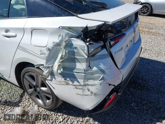 2021 Toyota Prius L Eco z VIN JTDKAMFUXM3142402, wystawiony jako IAAI lot #41665484 z przebiegiem 67 416 mil mil oraz . Historia ofert i sprzedaży dostępna na DreamBid. Obrazek 6.