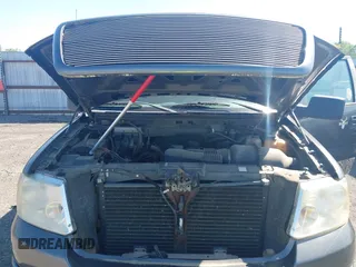 2007 Ford F-150 STX with VIN 1FTRX14W47FA54576, listed as a IAAI auction lot 41971521 with 220,945 mi miles. Bid and sale history available at carsss.com. Image 10.