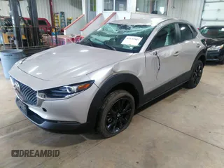 2024 Mazda CX-30 2.5 S Select Sport with VIN 3MVDMBBM0RM658069, listed as a IAAI auction lot 42130803 with 26,714 mi miles. Bid and sale history available at carsss.com. Image 2.
