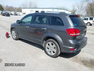 2014 Dodge Journey Limited with VIN 3C4PDDDG7ET138601, listed as a IAAI auction lot 42021766 with 214,220 mi miles and . Bid and sale history available at carsss.com. Image 3.