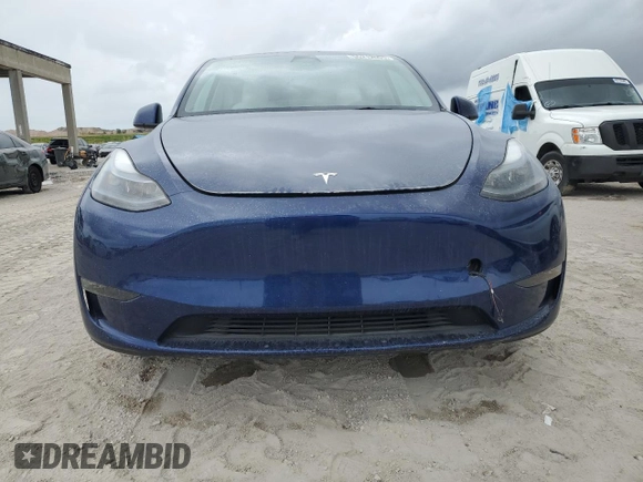 2023 Tesla Model Y Long Range z VIN 7SAYGDEE5PF787794, wystawiony jako Copart lot #55212605 z przebiegiem 30 277 mil mil oraz Szkoda całkowita • Salvage title. Historia ofert i sprzedaży dostępna na DreamBid. Obrazek 5.