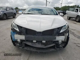 2015 Lincoln MKZ z VIN 3LN6L2J90FR601908, wystawiony jako Copart lot #55516355 z przebiegiem 127 487 mil mil oraz Szkoda całkowita • Salvage title. Historia ofert i sprzedaży dostępna na DreamBid. Obrazek 5.