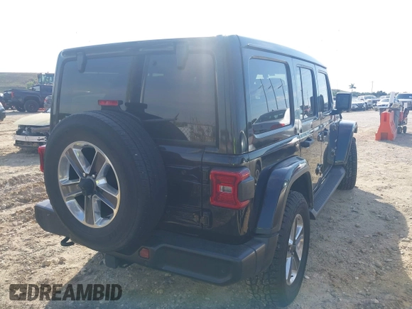 2021 Jeep Wrangler Unlimited Sahara with VIN 1C4HJXEG3MW536507, listed as a IAAI auction lot 41601893 with 51,214 mi miles and . Bid and sale history available at DreamBid. Image 4.
