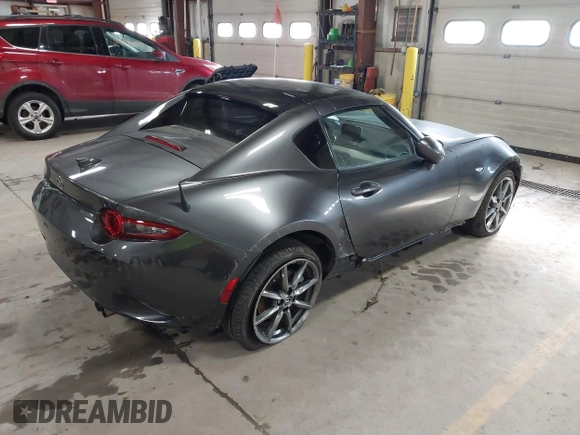 2021 Mazda MX-5 Miata Grand Touring with VIN JM1NDAM73M0451484, listed as a IAAI auction lot 41485044 with 11,328 mi miles and . Bid and sale history available at DreamBid. Image 4.
