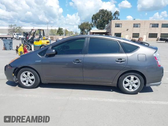 2007 Toyota Prius z VIN JTDKB20U273215633, wystawiony jako IAAI lot #41955538 z przebiegiem 172 957 mil mil oraz . Historia ofert i sprzedaży dostępna na DreamBid. Obrazek 14.