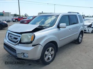 2011 Honda Pilot EX-L with VIN 5FNYF4H54BB099550, listed as a IAAI auction lot 42107327 with 217,050 mi miles and . Bid and sale history available at carsss.com. Image 2.