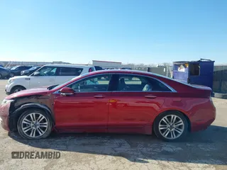 2015 Lincoln MKZ z VIN 3LN6L2G9XFR618075, wystawiony jako IAAI lot #41469247 z przebiegiem 152 966 mil mil oraz . Historia ofert i sprzedaży dostępna na DreamBid. Obrazek 14.