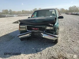1997 GMC Suburban z VIN 3GKFK16R7VG514905, wystawiony jako Copart lot #77410934 z przebiegiem 193 116 mil mil oraz Szkoda całkowita • Salvage title. Historia ofert i sprzedaży dostępna na DreamBid. Obrazek 12.