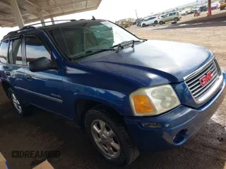 2006 GMC Envoy SLE with VIN 1GKDT13S362236574, listed as a IAAI auction lot 41872403 with 152,035 mi miles. Bid and sale history available at carsss.com. Image 1.
