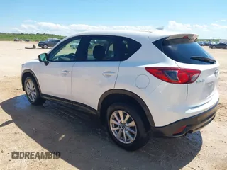2016 Mazda CX-5 Touring z VIN JM3KE2CY0G0840918, wystawiony jako IAAI lot #42205529 z przebiegiem 74 515 mil mil oraz . Historia ofert i sprzedaży dostępna na DreamBid. Obrazek 3.