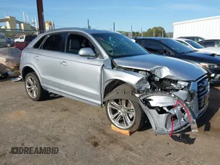 2017 Audi Q3 Premium Plus z VIN WA1JCCFSXHR000319, wystawiony jako IAAI lot #41986889 z przebiegiem 74 675 mil mil oraz . Historia ofert i sprzedaży dostępna na DreamBid. Obrazek 1.