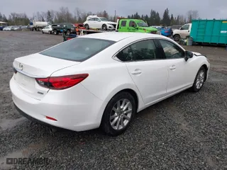 2016 Mazda Mazda6 i Sport with VIN JM1GJ1U52G1431967, listed as a IAAI auction lot 41602804 with 130,579 mi miles. Bid and sale history available at carsss.com. Image 4.