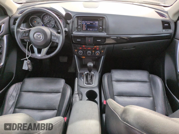 2015 Mazda CX-5 Grand Touring with VIN JM3KE4DY3F0495411, listed as a Copart auction lot 50077765 with 136,191 mi miles and Salvage Title. Bid and sale history available at DreamBid. Image 8.