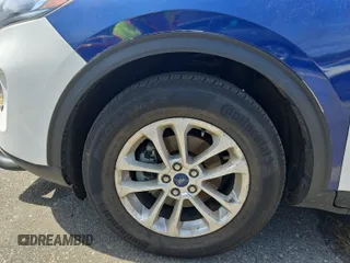 2021 Ford Escape SE z VIN 1FMCU9G64MUA99657, wystawiony jako IAAI lot #42411545 z przebiegiem 62 638 mil mil oraz . Historia ofert i sprzedaży dostępna na DreamBid. Obrazek 1.