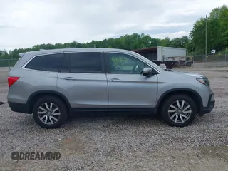 2021 Honda Pilot EX-L with VIN 5FNYF6H50MB063465, listed as a IAAI auction lot 42160636 with 28,595 mi miles and . Bid and sale history available at DreamBid. Image 13.
