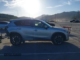 2016 Mazda CX-5 Grand Touring z VIN JM3KE2DY8G0709573, wystawiony jako IAAI lot #42021005 z przebiegiem 113 941 mil mil oraz . Historia ofert i sprzedaży dostępna na DreamBid. Obrazek 14.